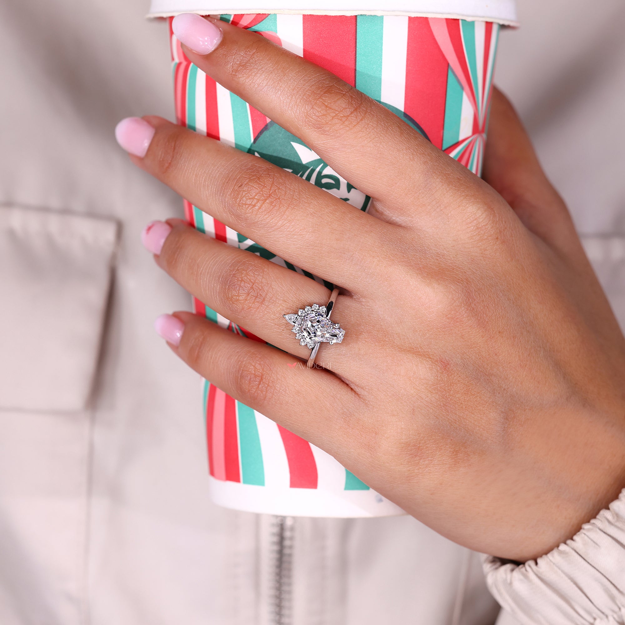 Pear cut diamond ring with soft vintage look.