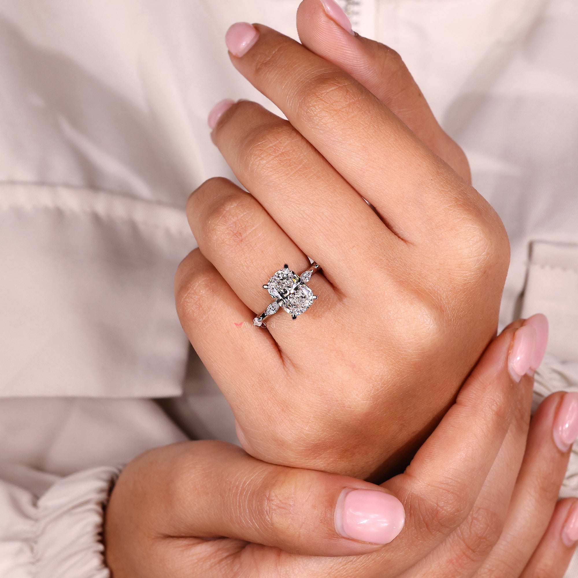 Distance pave ring with a smooth and detailed white gold band.