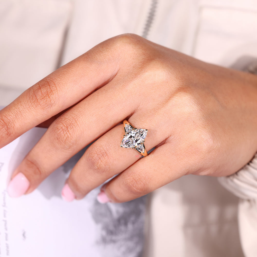 Lab grown marquise diamond engagement ring.
