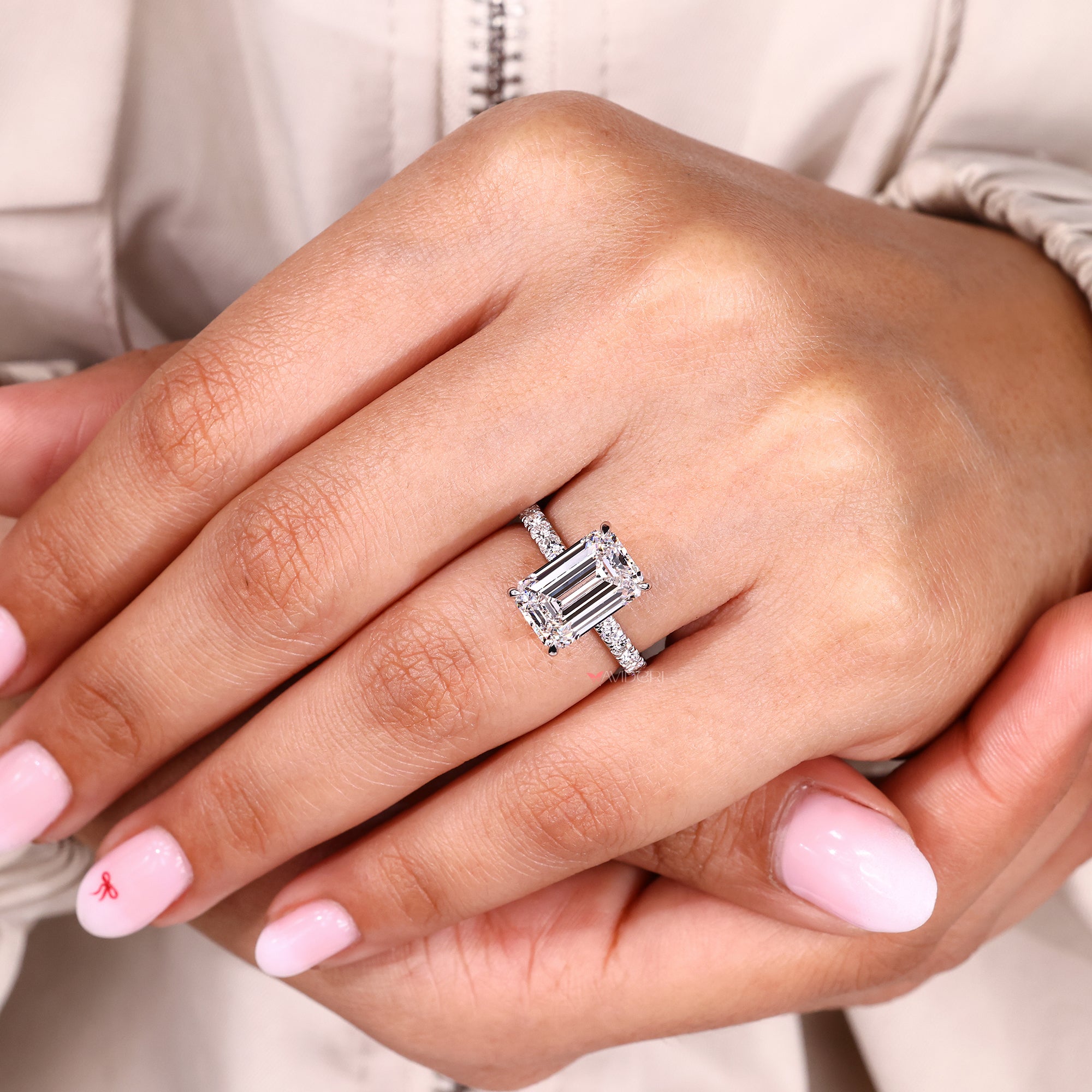 IGI certified emerald cut diamond ring in pave style.
