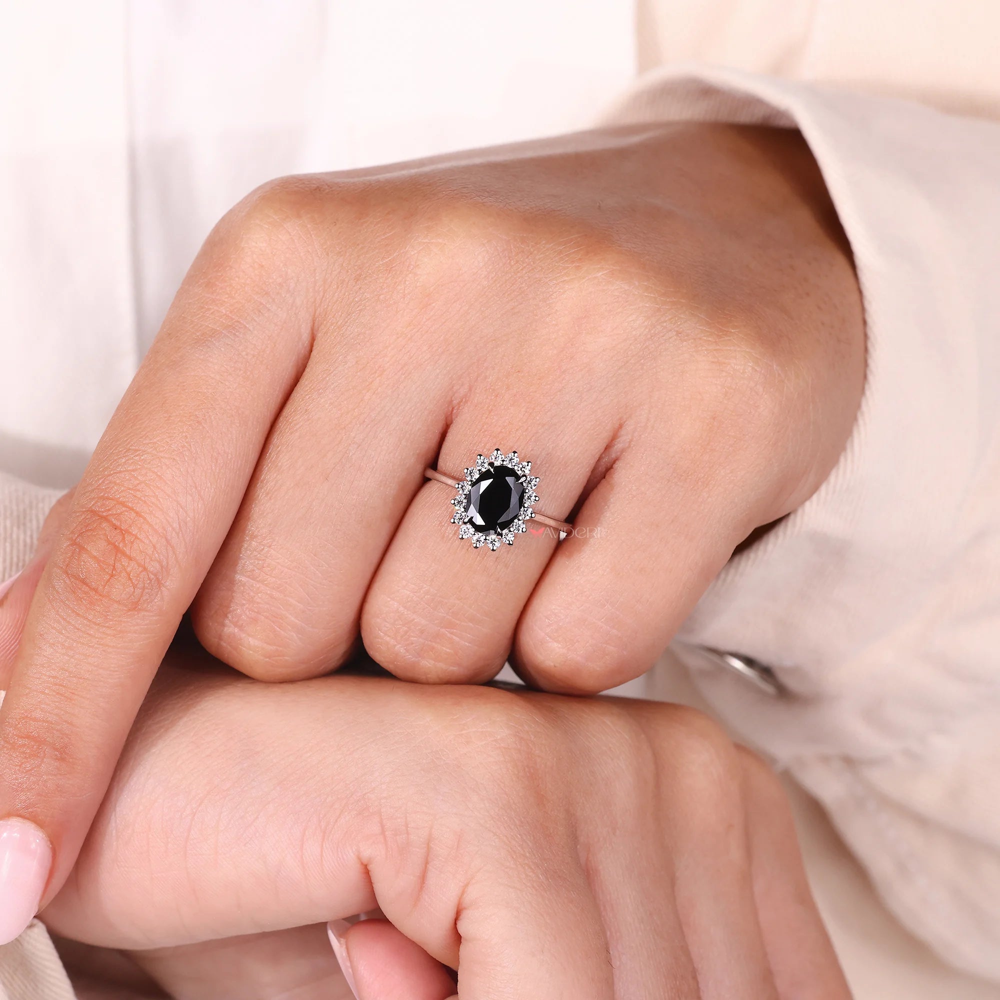 Cluster halo ring with sparkling moissanite stones.