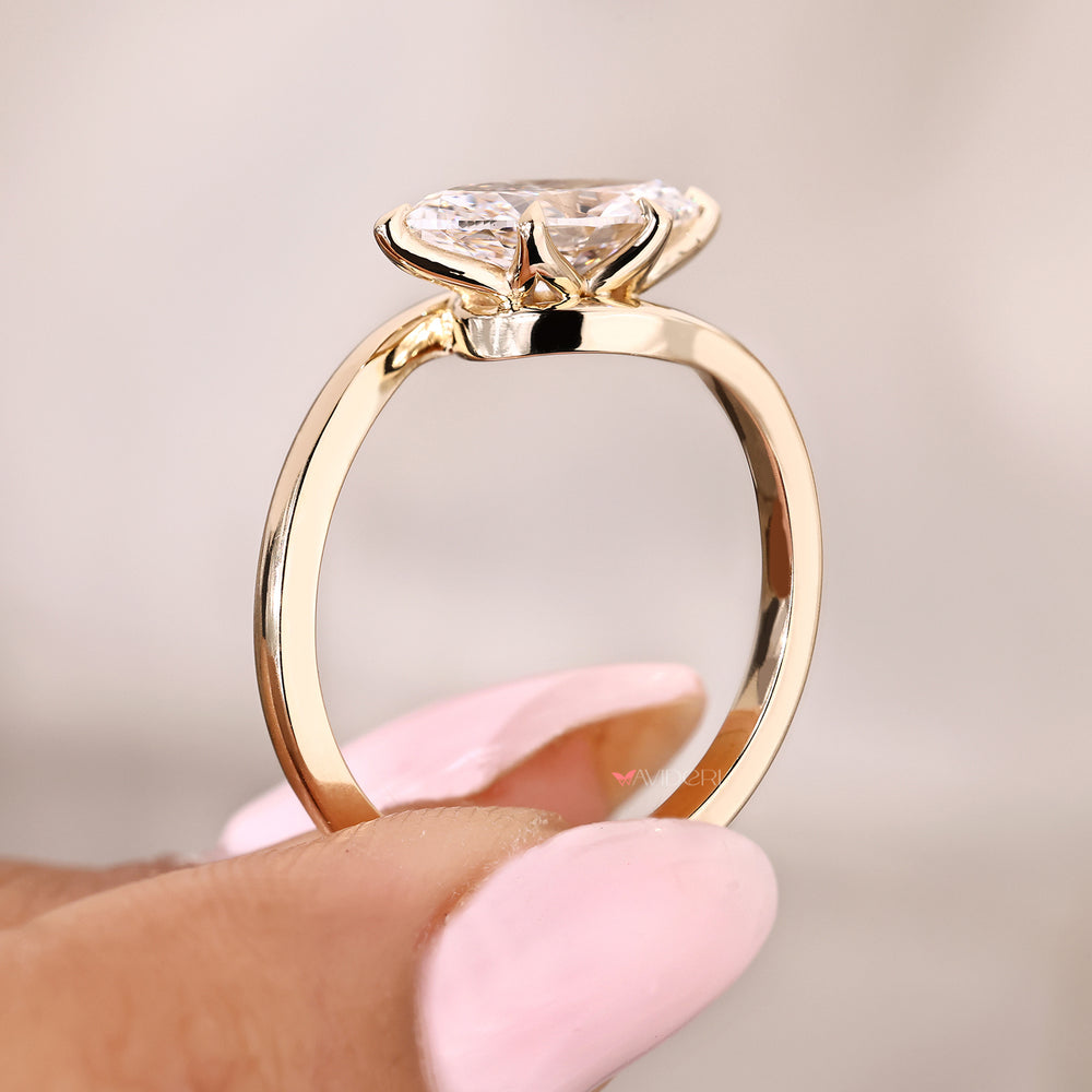 Marquise cut diamond ring with tulip and claw prongs
