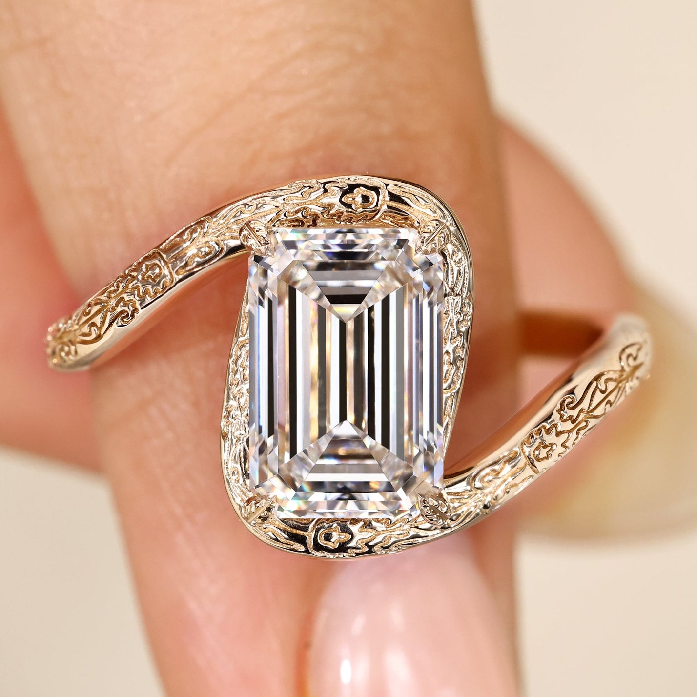 Emerald cut diamond ring with bypass setting.
