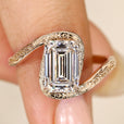 Emerald cut diamond ring with bypass setting.
