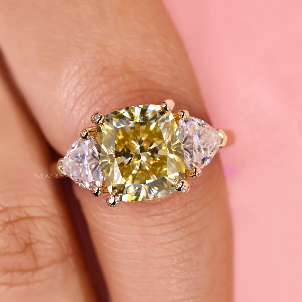 Moissanite three stone ring with modern v prong setting.
