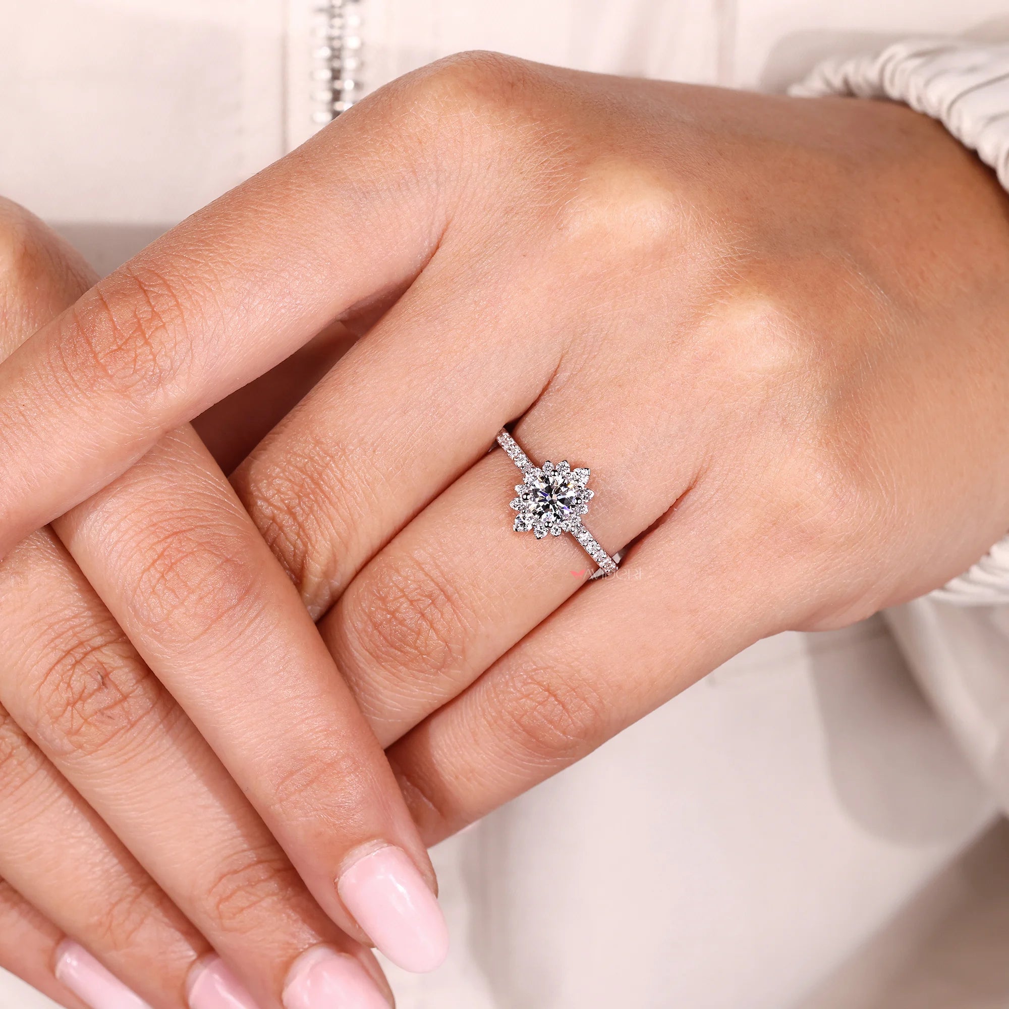 Round diamond engagement ring with 4 prong setting.