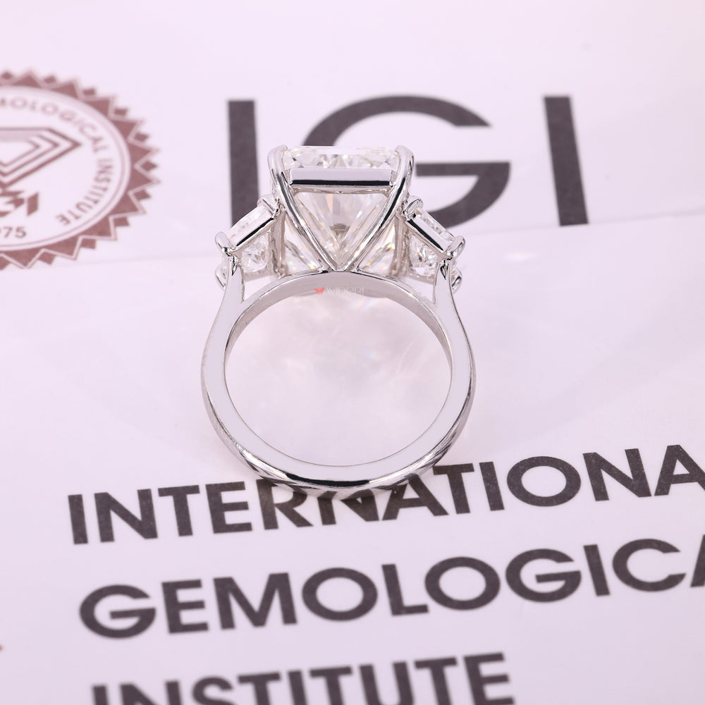 Cathedral engagement ring with three stone diamond ring.