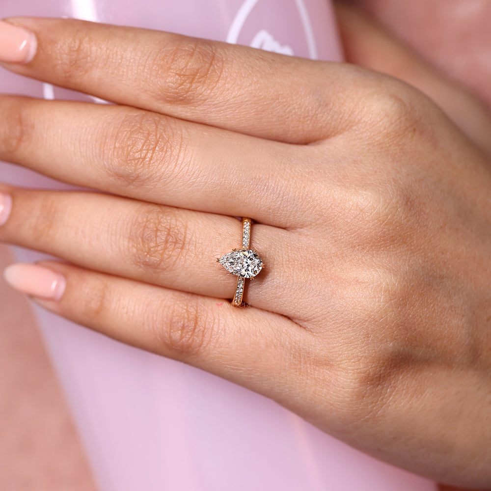 Pear cut lab grown diamond ring with heart prongs.
