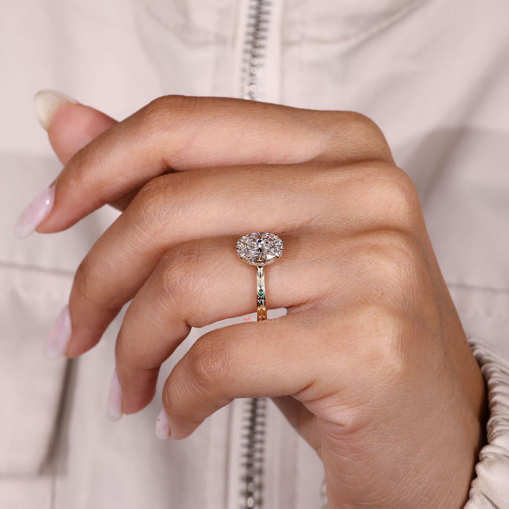 Handmade oval cut diamond ring with engraved detail.
