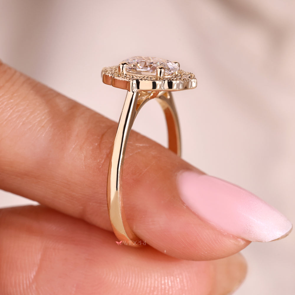 Vintage style oval diamond ring with milgrain setting.