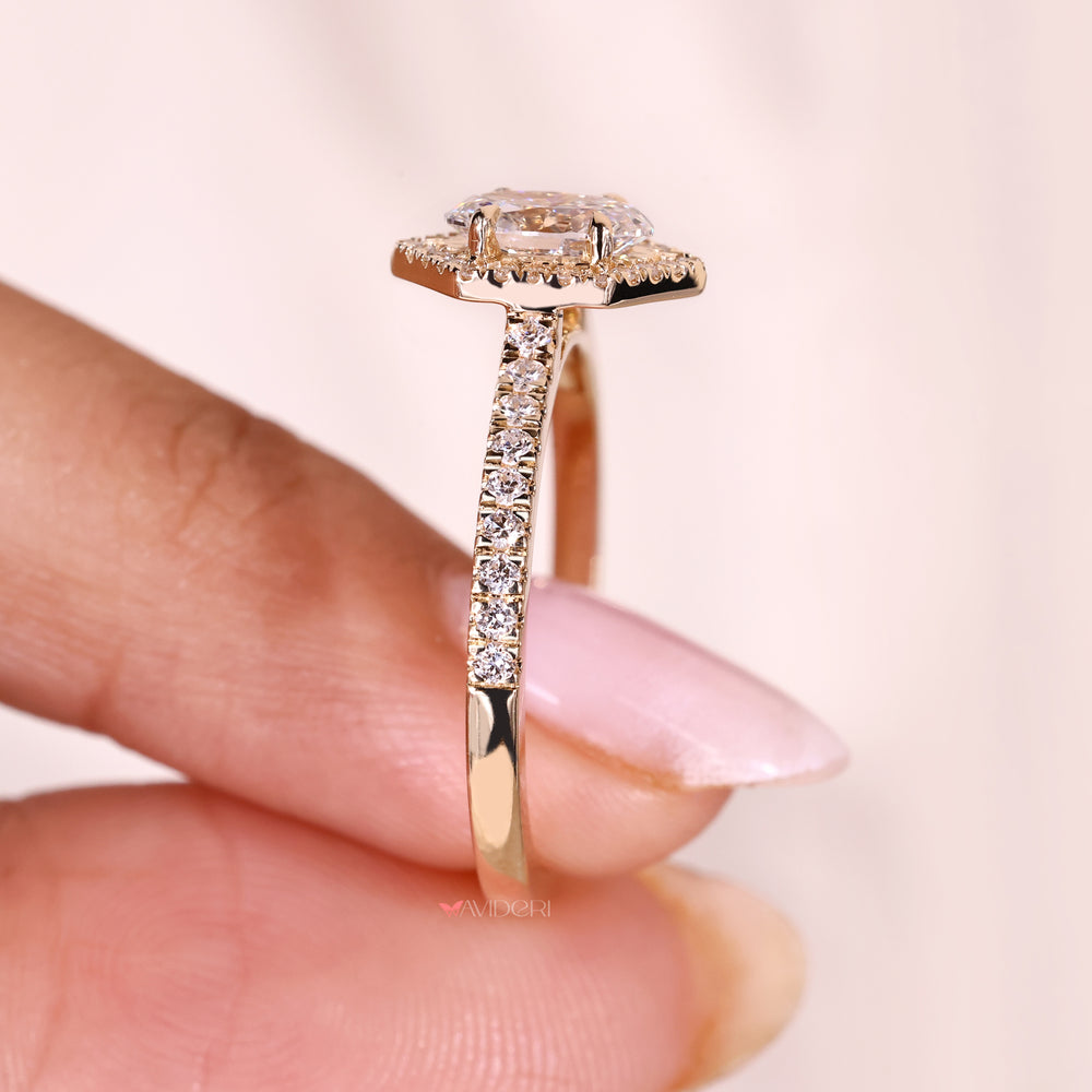 Oval ring with cathedral and pave setting.
