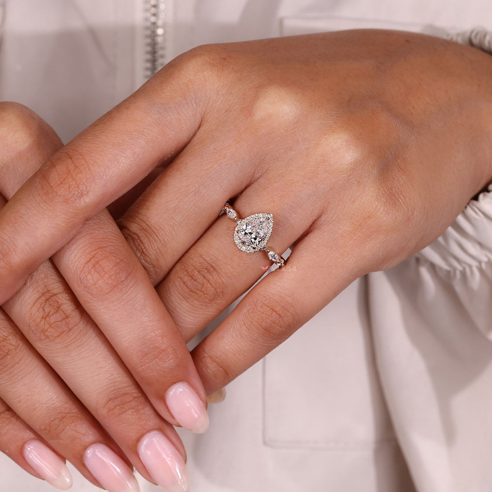 Lab grown pear diamond with halo design.
