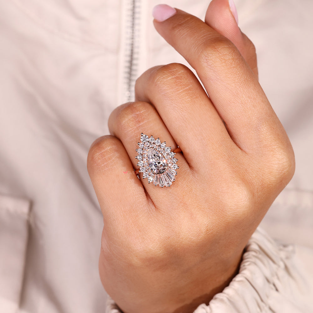 Lab grown diamond pear cut ring with tapered baguette stones.