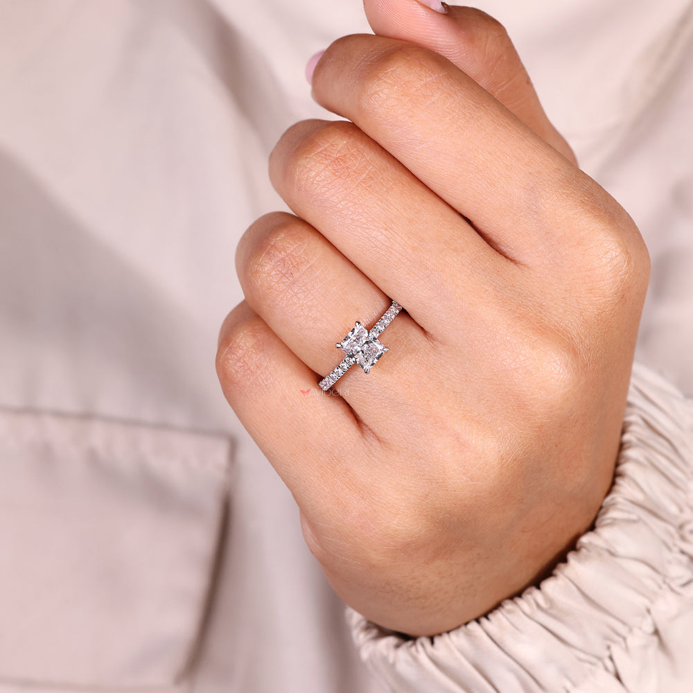 Radiant cut ring with four claw prong setting.
