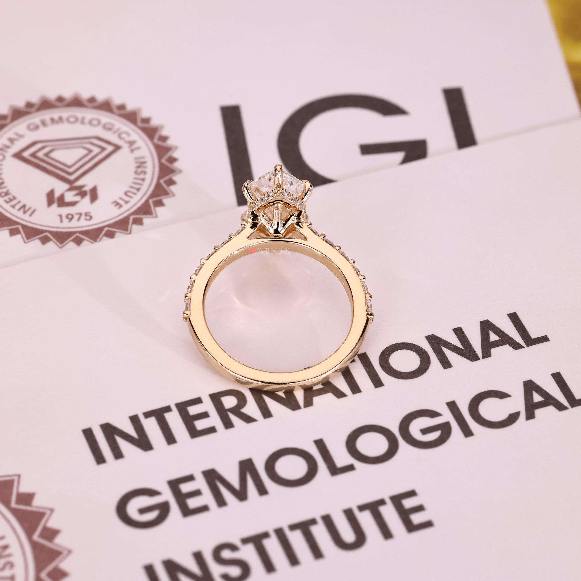 Yellow gold diamond ring with lab-grown diamond ring.