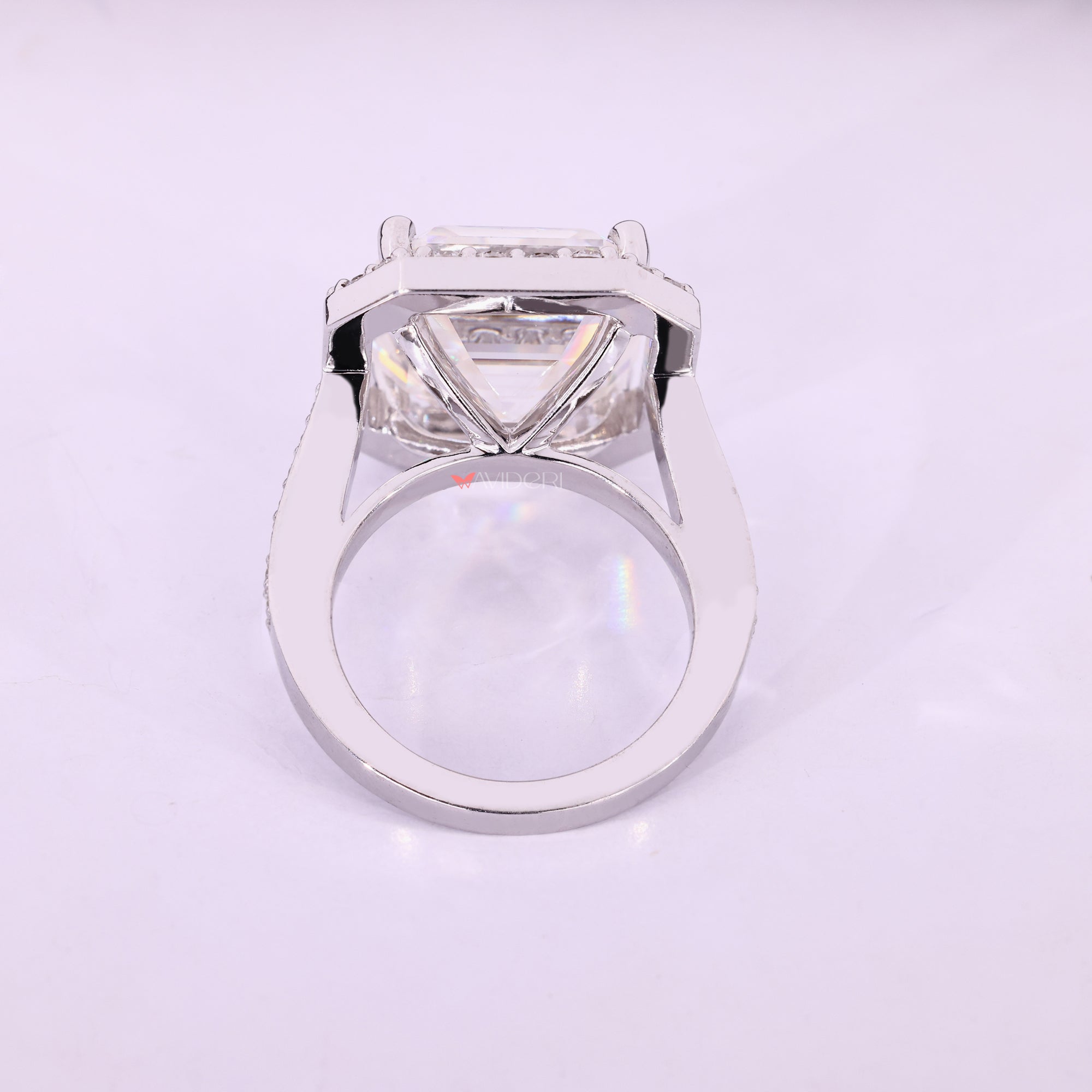 Cathedral setting Asscher cut moissanite halo ring.