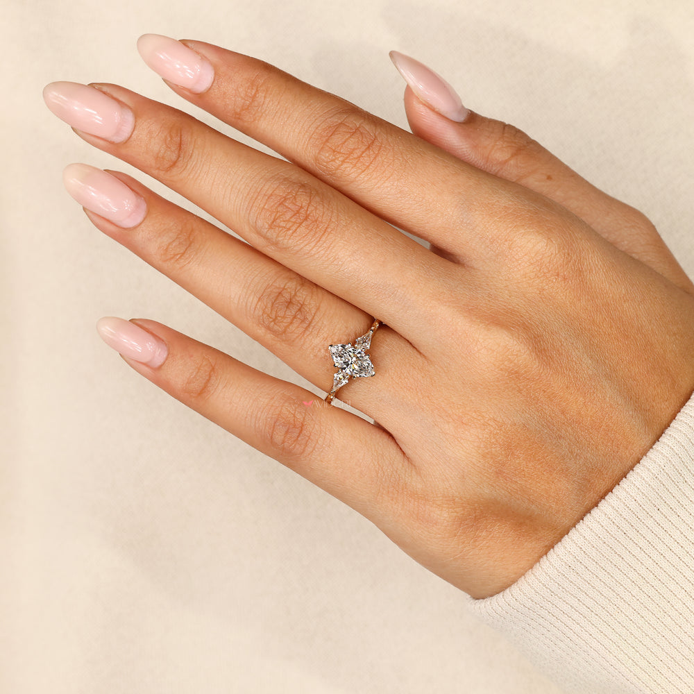 Vintage marquise ring with cathedral shank detail.
