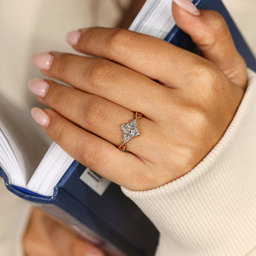 Marquise ring with four claw prong setting.
