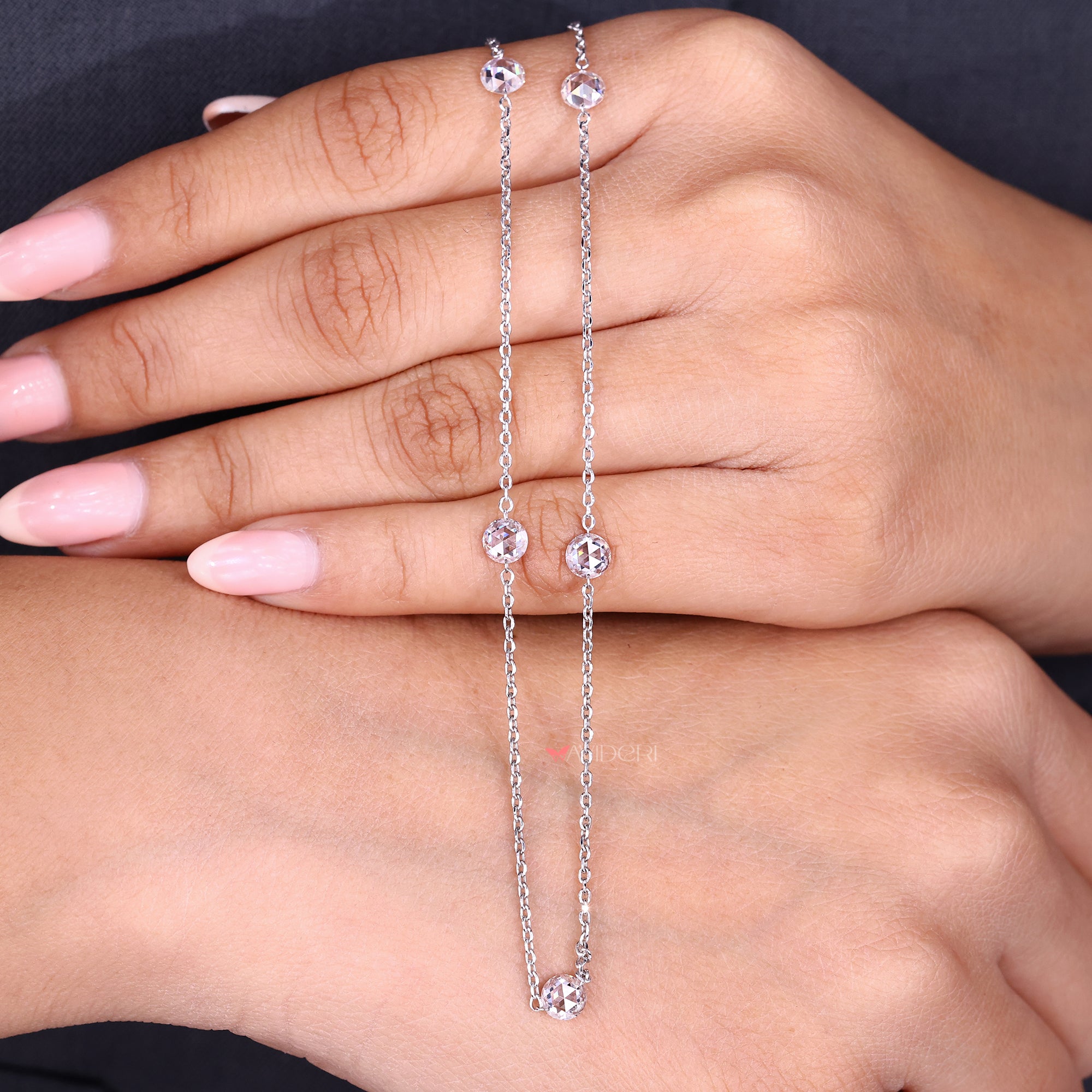 Round rose cut diamond necklace on a fine chain.