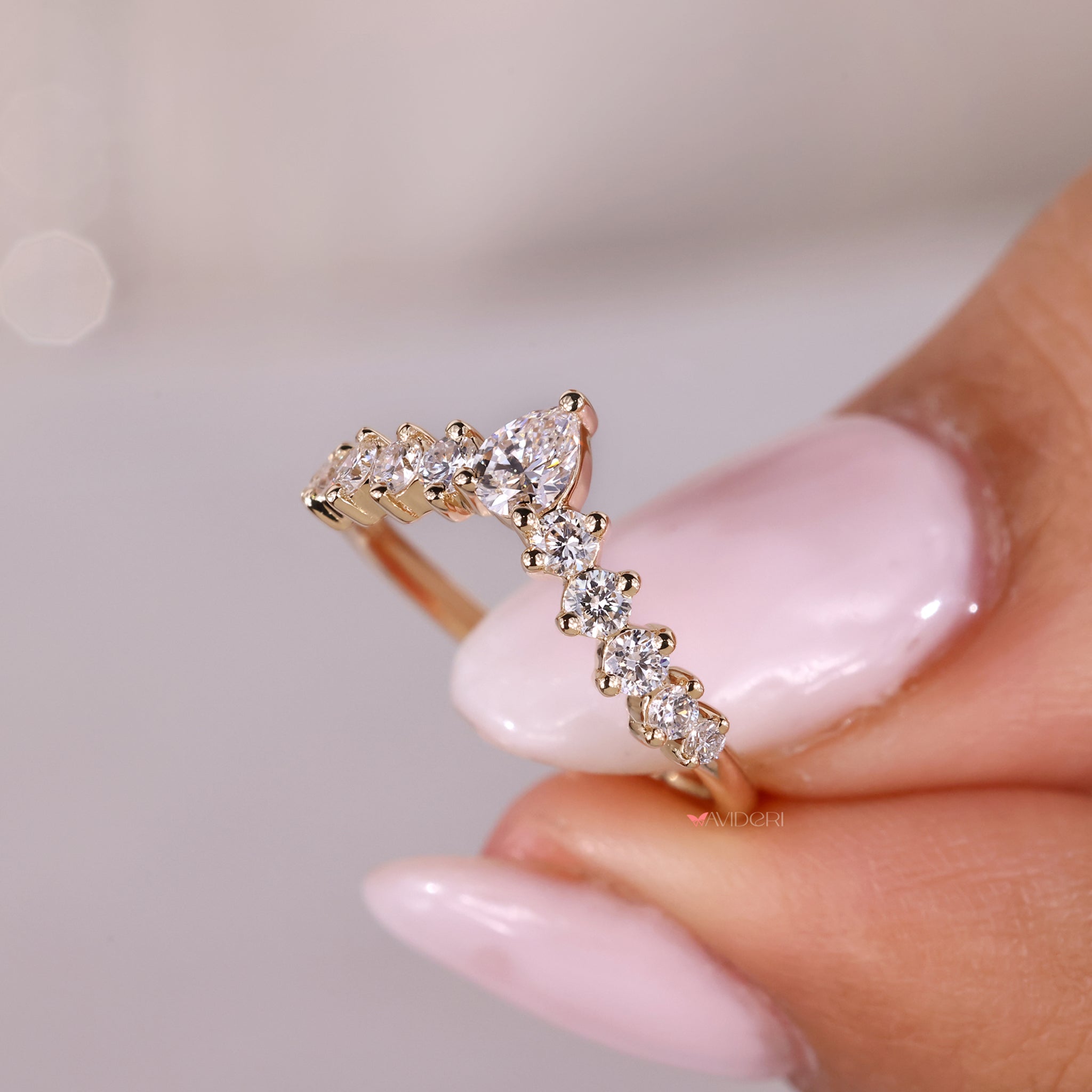 Handmade jewelry featuring a pear shaped diamond band for refined style.
