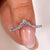 Pear and round diamond band with white gold wedding band.