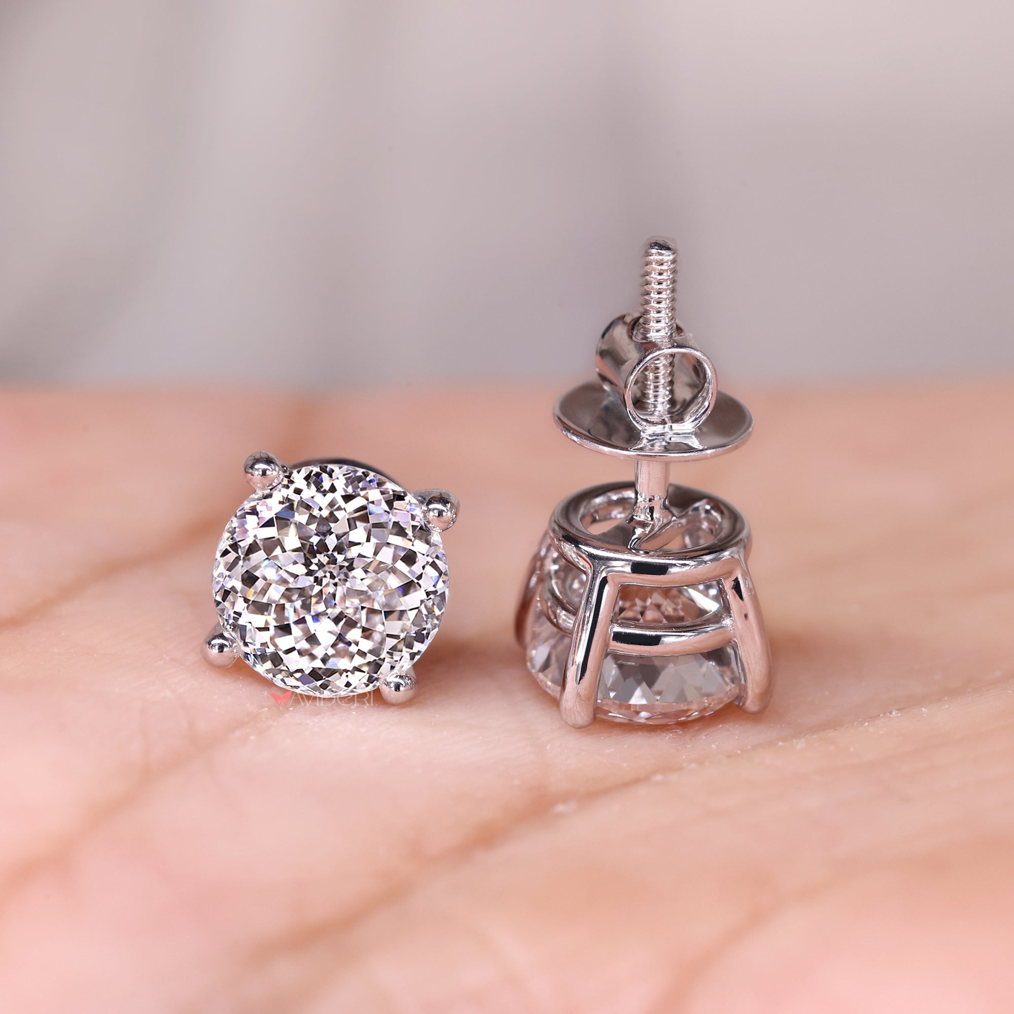 Solitaire diamond earrings and classic stud earrings.
