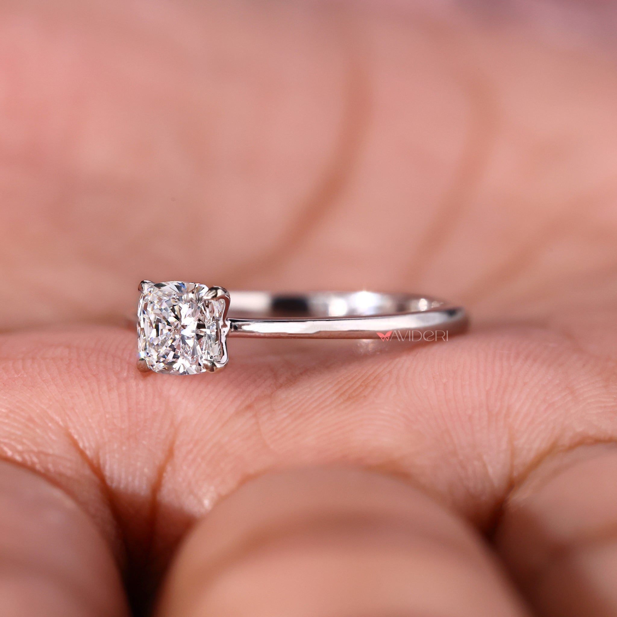 Cushion cut solitaire ring designed with handmade jewelry artistry and lab grown diamond.
