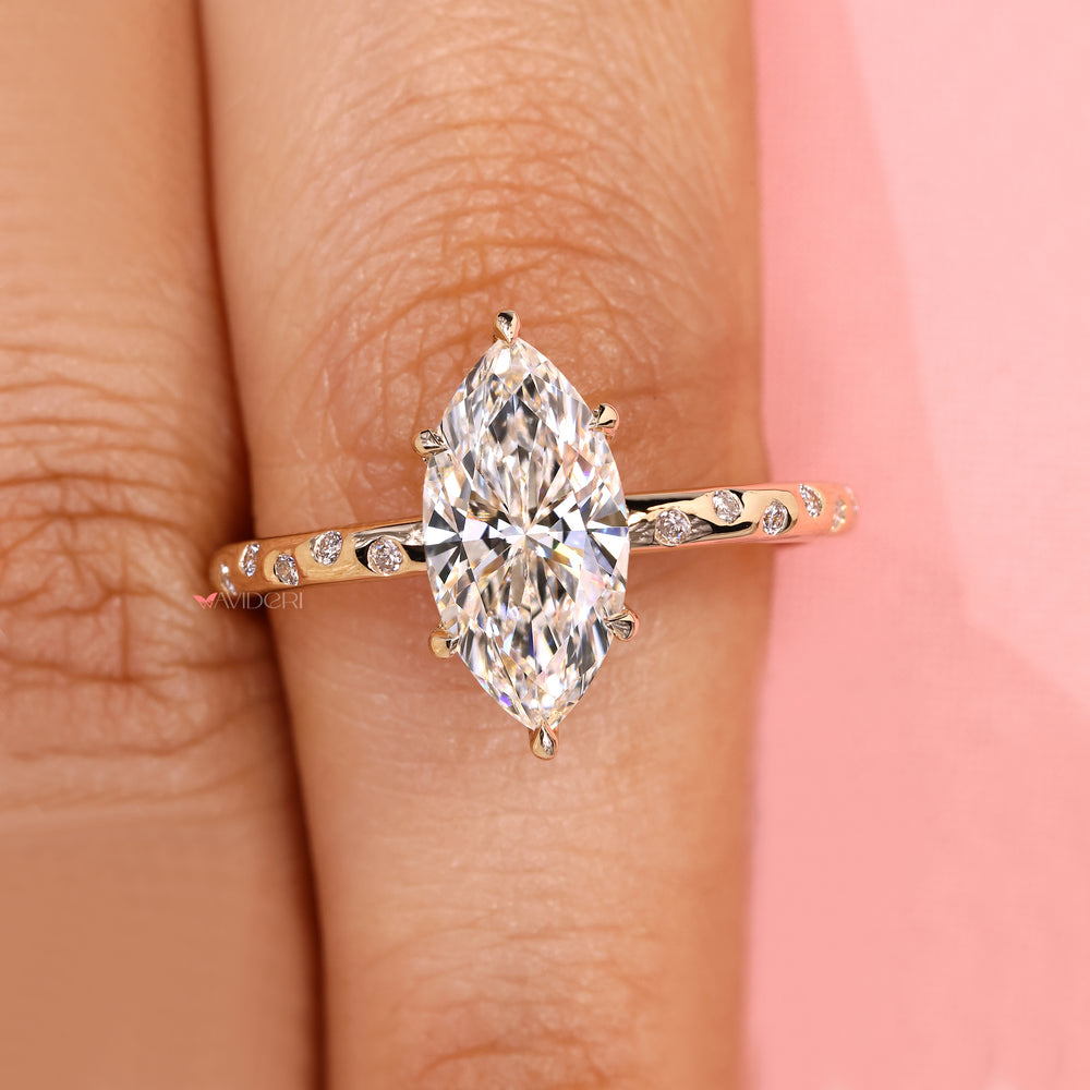 Marquise ring with round diamond pave design.
