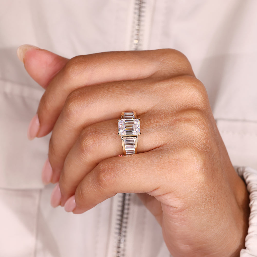 Emerald ring with tapered shank and prongs.
