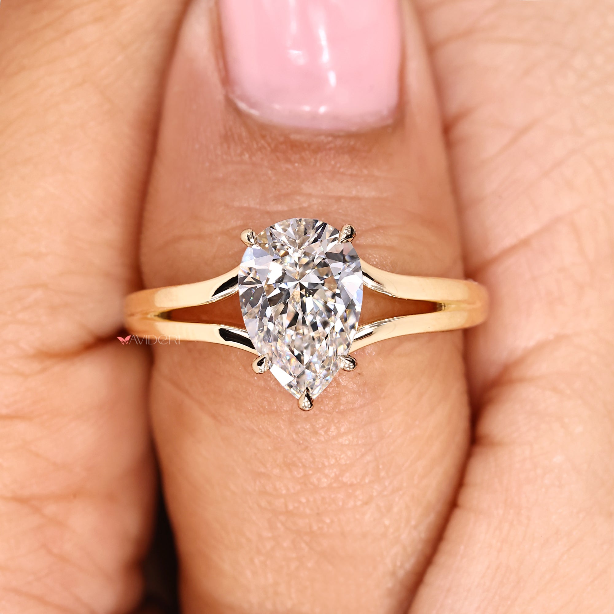 Solitaire pear cut diamond ring featuring IGI certified lab grown stone.