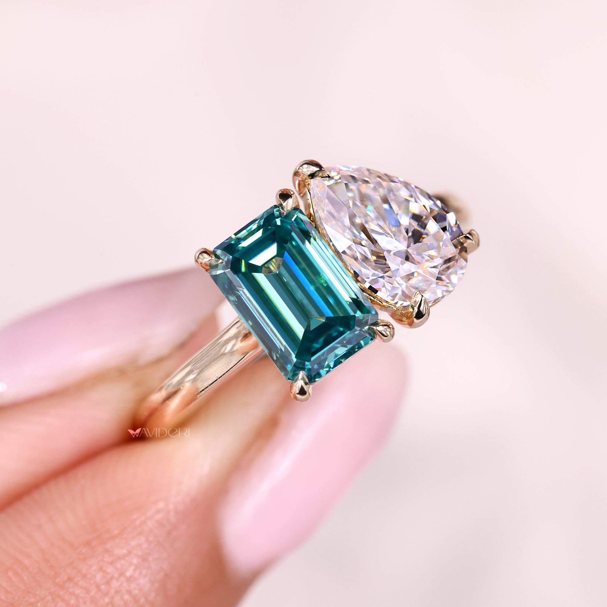 Buy a moissanite ring with pear and emerald cut design.