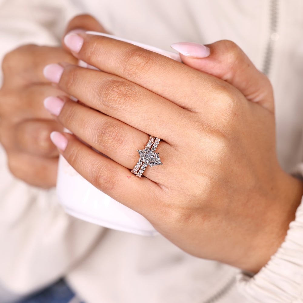 Marquise ring with hidden halo pave and band set.
