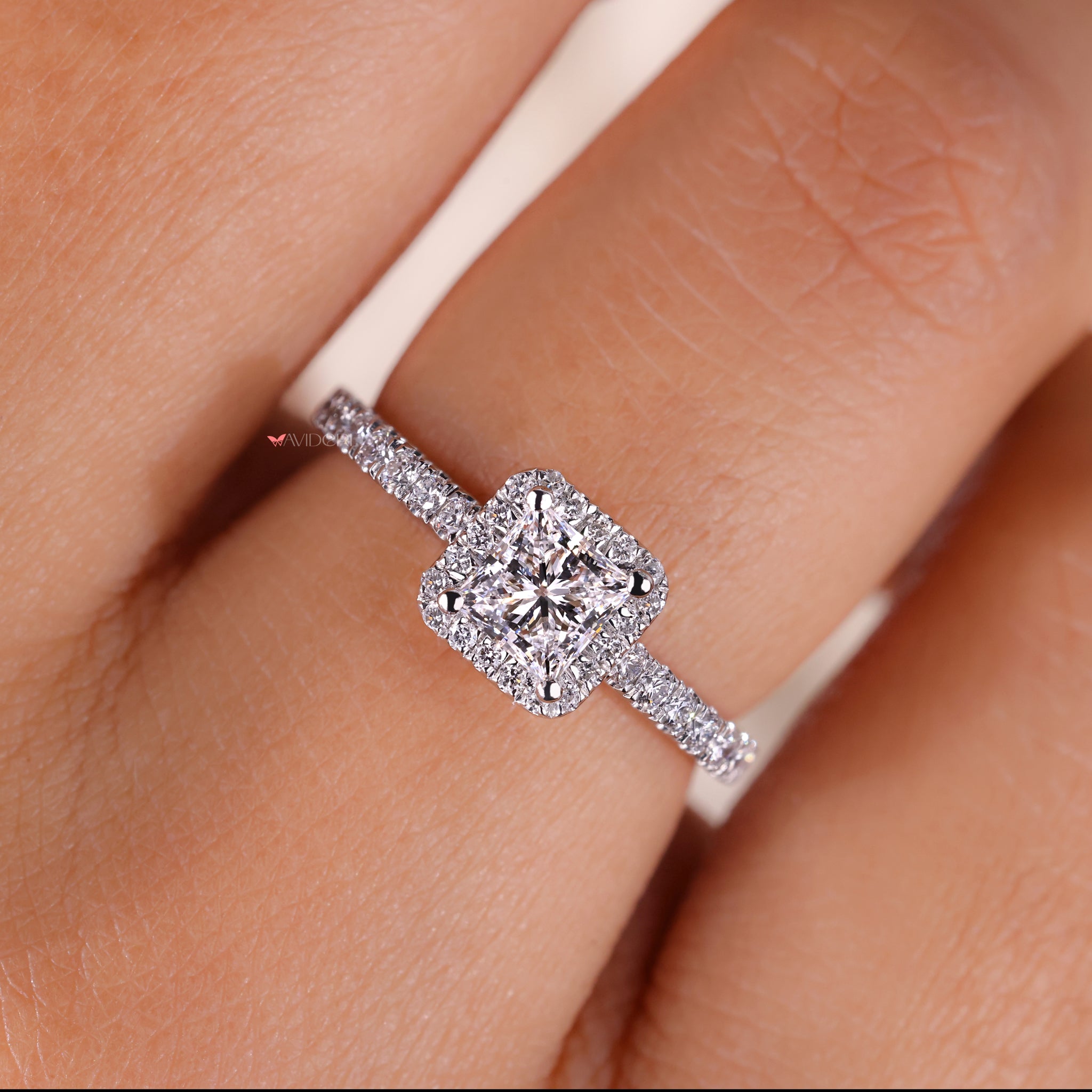 Princess cut with halo showcasing a radiant centerpiece surrounded by intricate detailing, ideal for engagements or special occasions.
