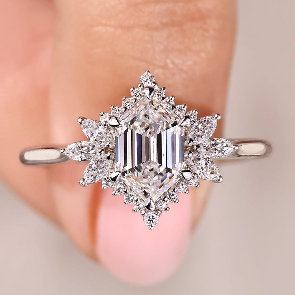 Hexagon engagement ring with marquise and round side stone.
