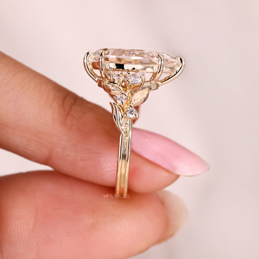 Lab grown pear cut diamond ring with six claw prong setting.
