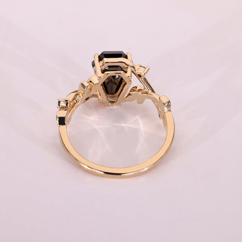 Yellow gold moissanite ring with a clean four claw prong setting.