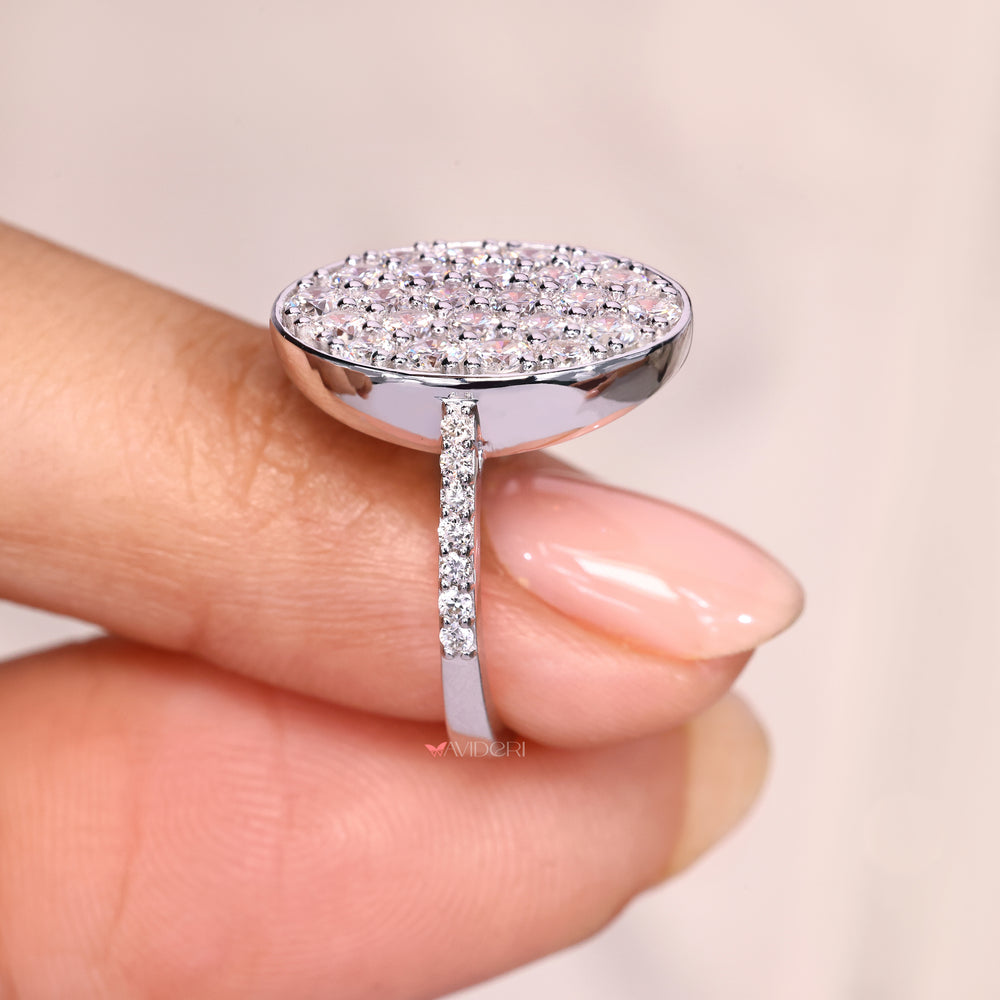 Handmade round diamond ring with pave style detailing.

