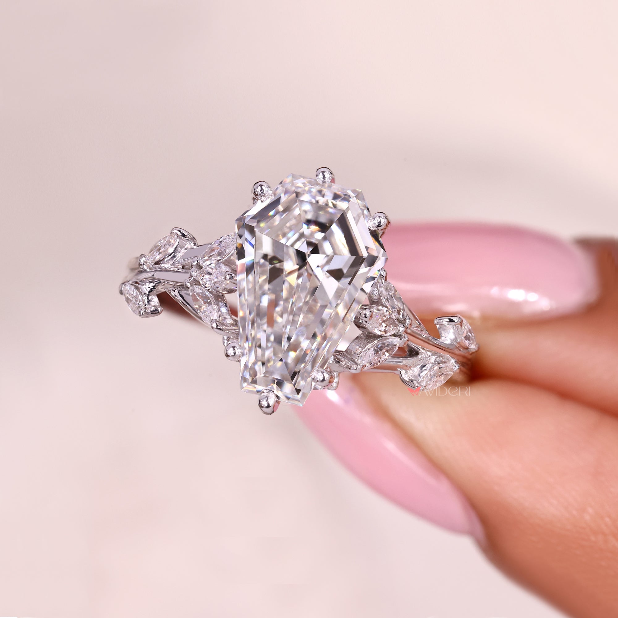 Lab grown coffin cut diamond ring with marquise sides.
