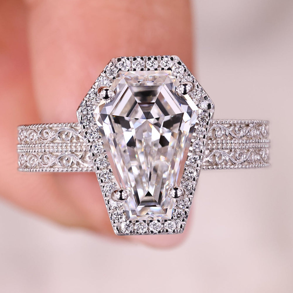 Halo diamond engagement ring with coffin cut engagement ring.
