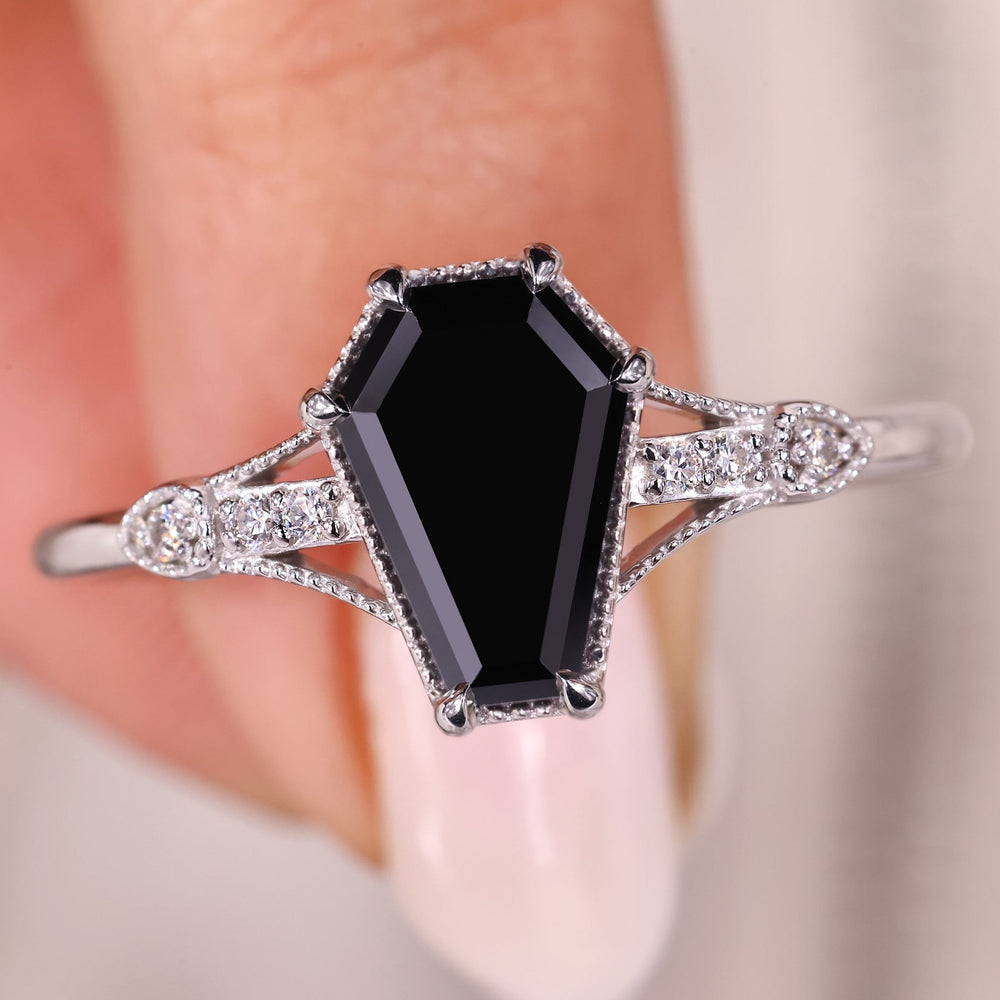 Black moissanite ring with a sleek, modern design for timeless elegance.