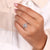 Halo setting for round diamond on a white gold engagement ring.