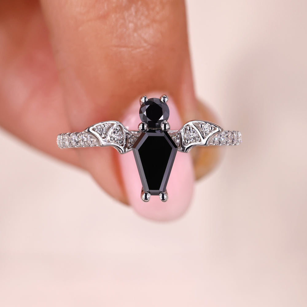 Bat bird shape ring with bat engagement ring.