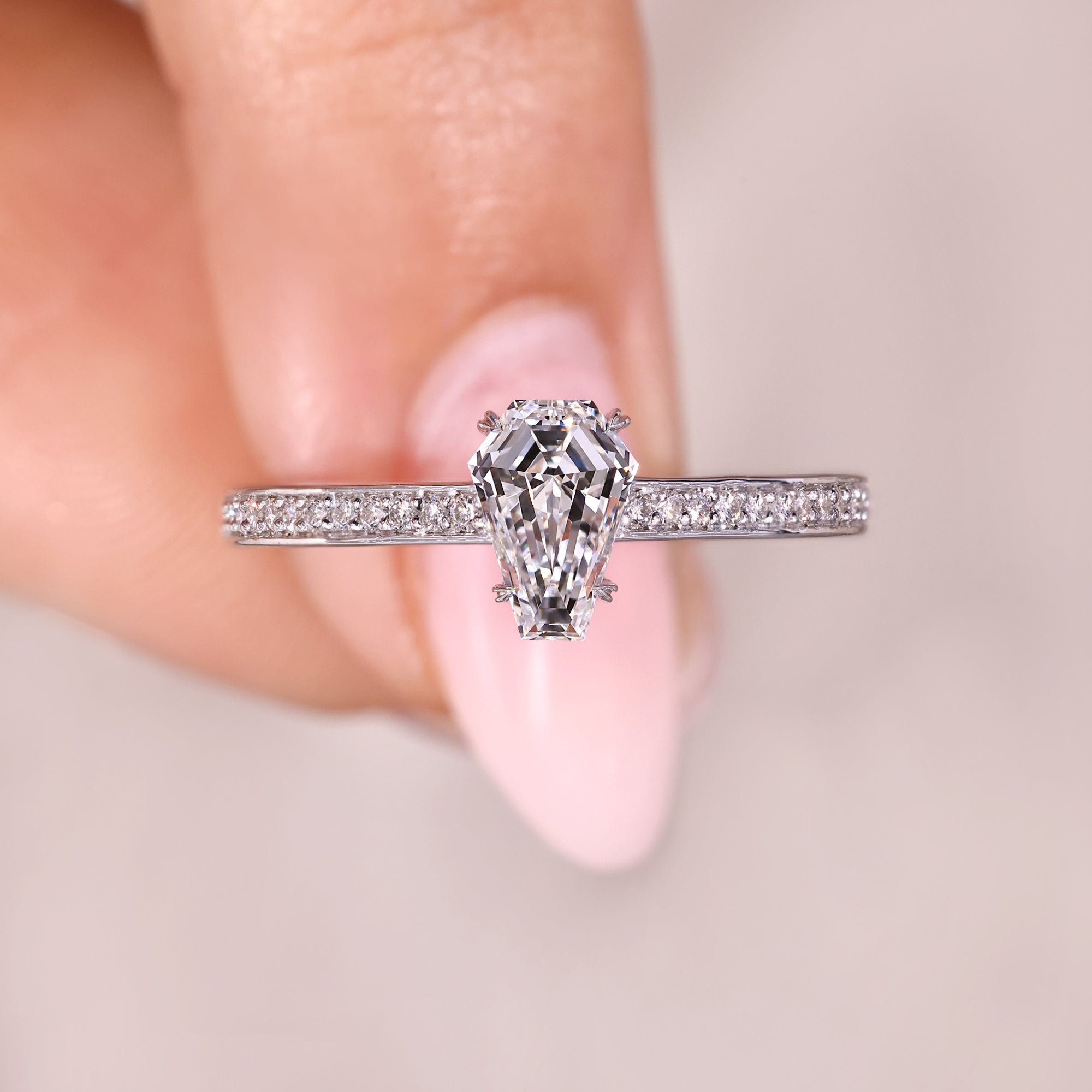 Coffin cut engagement ring with heart shape prong.