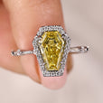 Coffin cut engagement ring with canary yellow ring.