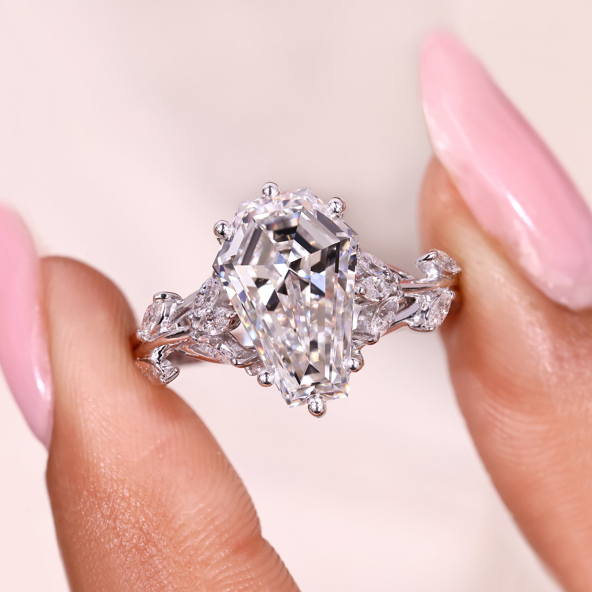 Coffin cut ring with six prong nature inspired setting.
