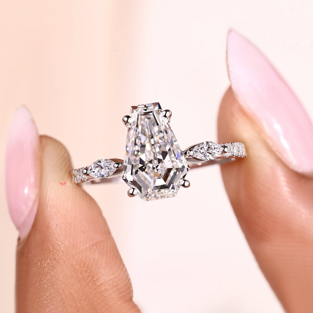 Lab grown coffin cut diamond ring with four prongs.