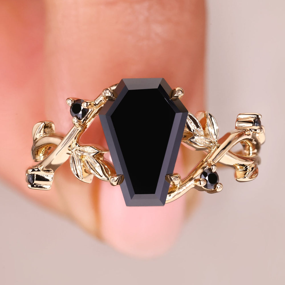 Coffin cut ring with bold black moissanite center.