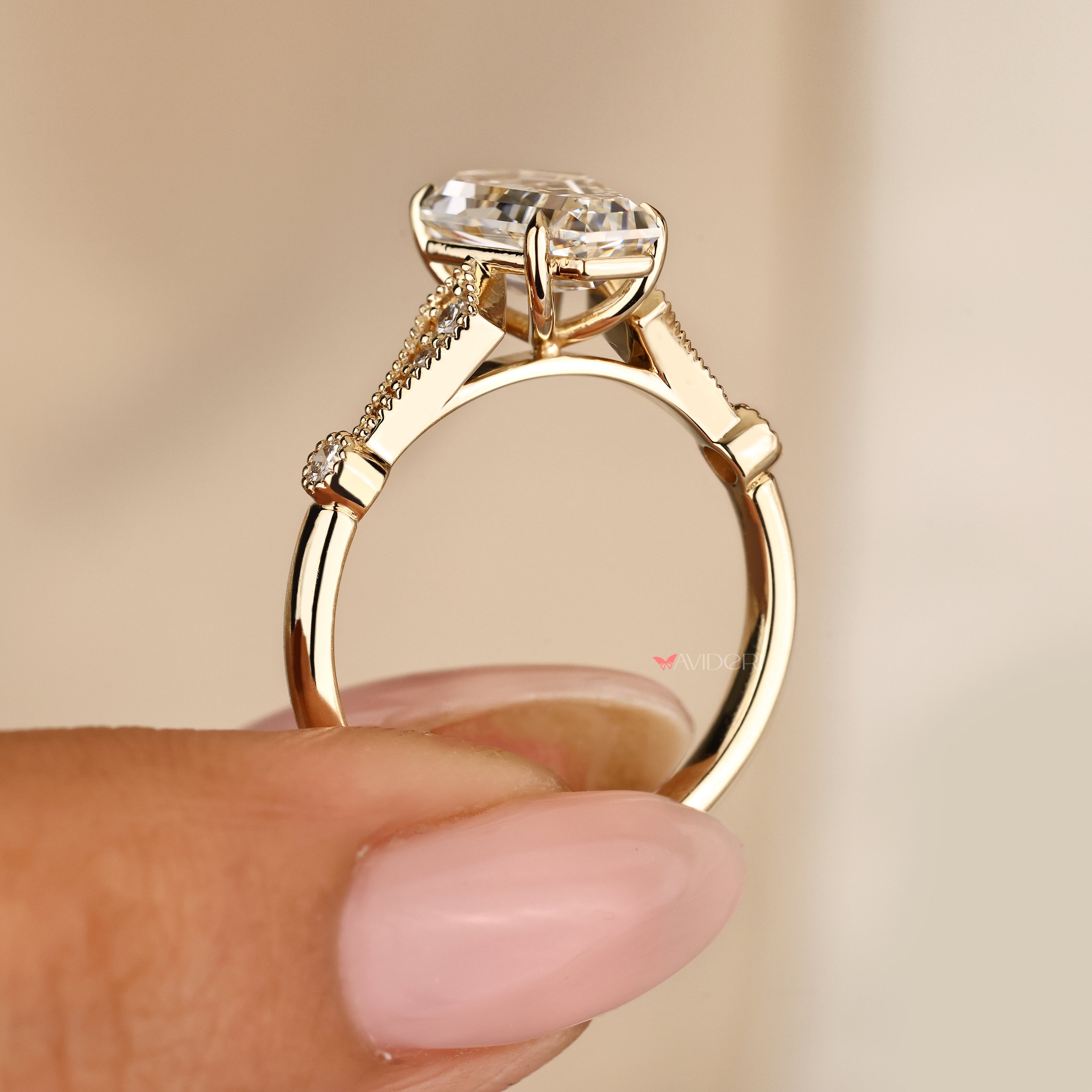 Coffin cut engagement ring with milgrain and side stones
