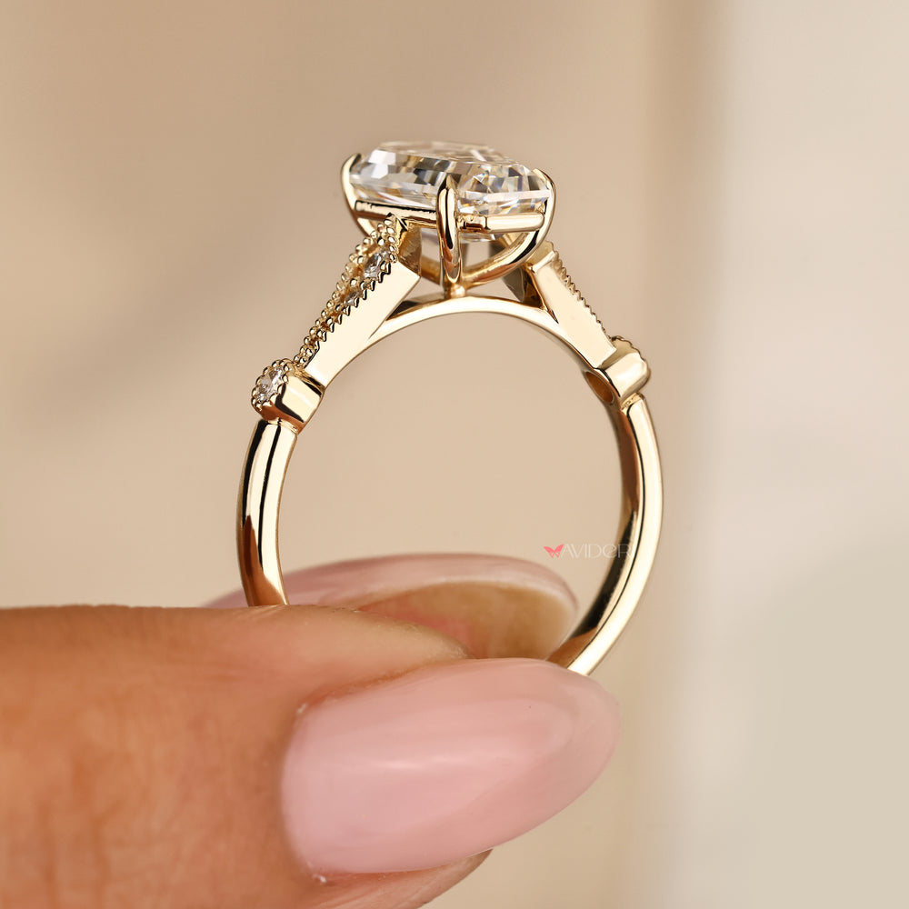 Coffin cut engagement ring with milgrain and side stones
