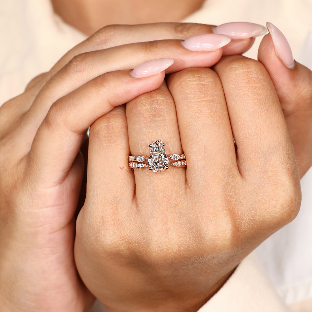 Handmade coffin diamond ring with side stones.
